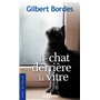Le chat derrière la vitre