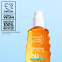 Garnier Ambre Solaire Eau Biphase SPF 50 - Protection Solaire Légère pour Visage, Corps & Cheveux